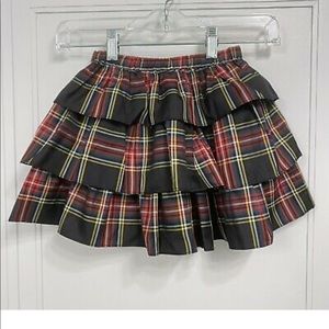 Girls' tiered skirt in tartan skirt. Never worn. Size small